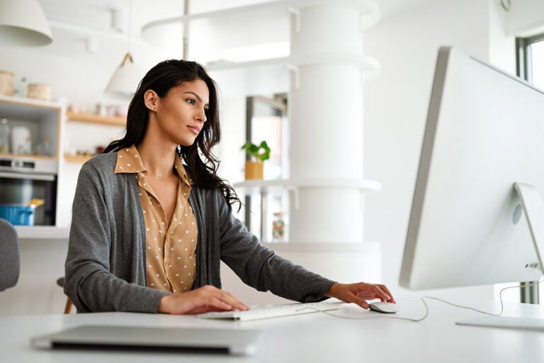 Woman at home working on a computer